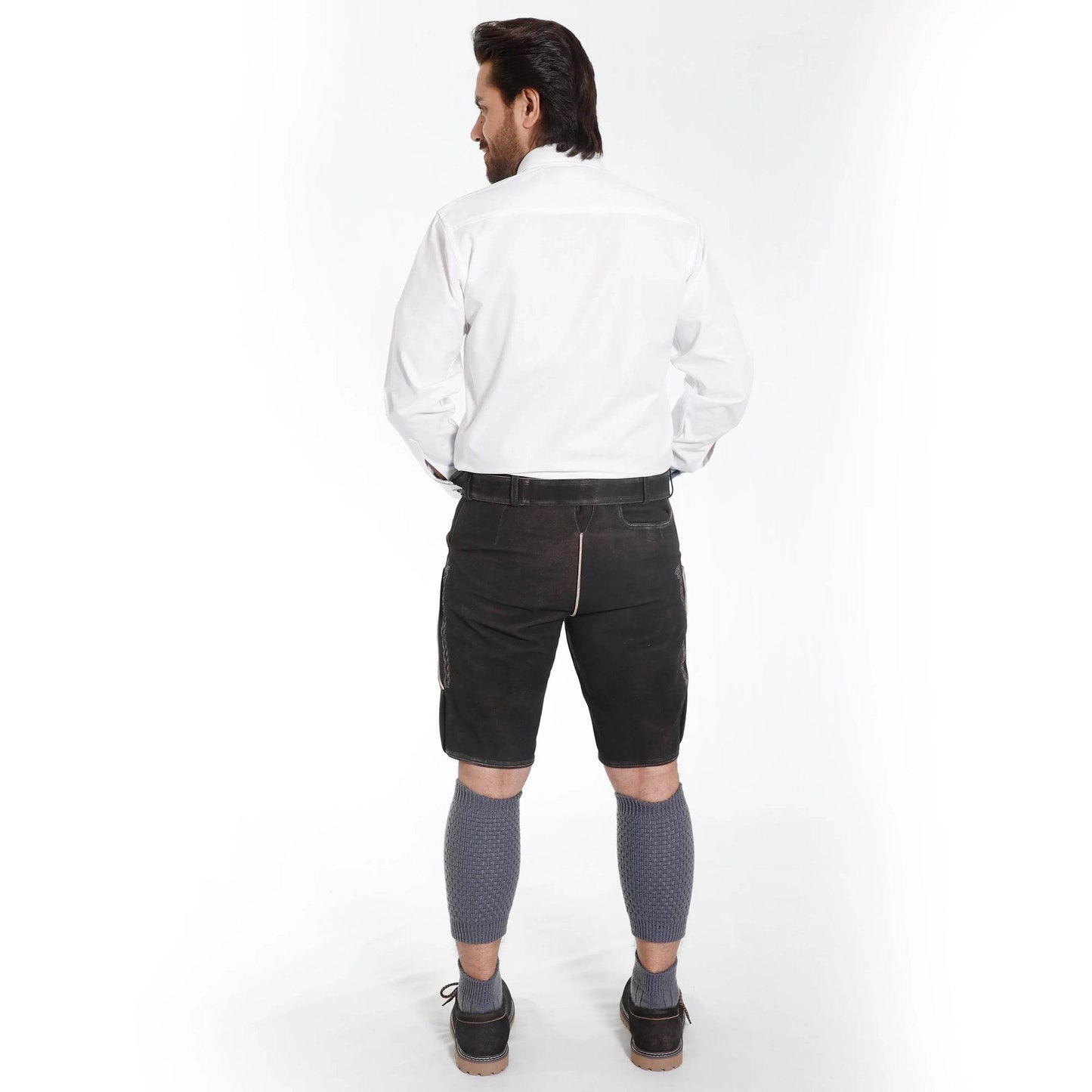 Back view of black leather lederhosen shorts with belt and decorative embroidered accents.