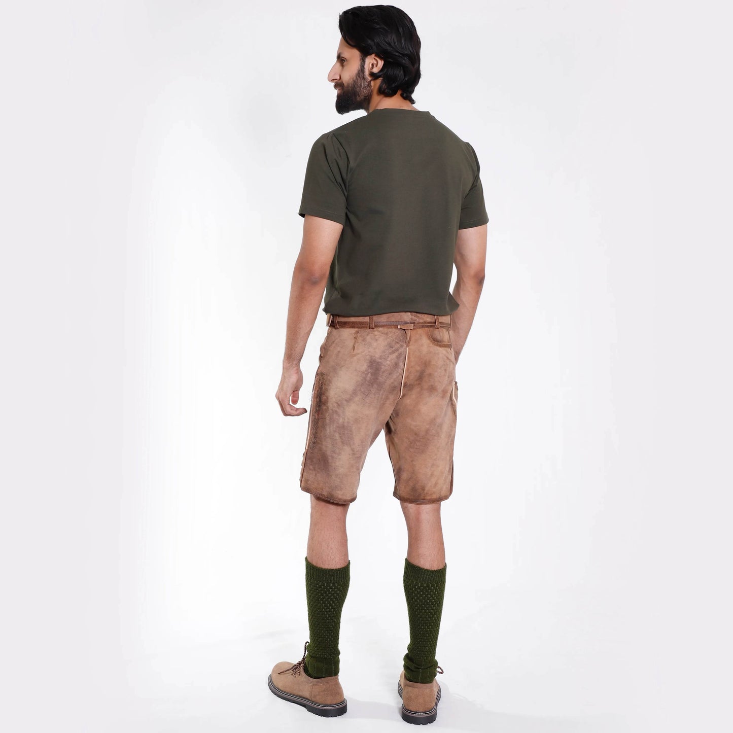 Side view of men’s brown suede short leather trousers with belt, embroidered front, and knee-length cut