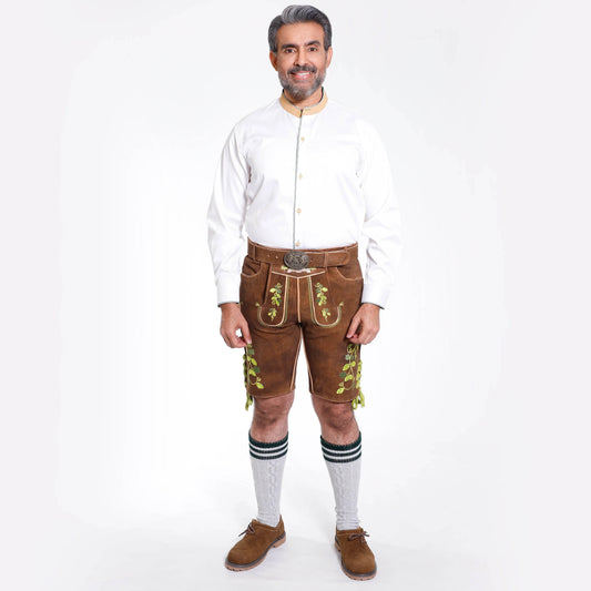 Brown suede lederhosen with green floral embroidery and round belt buckle, knee length