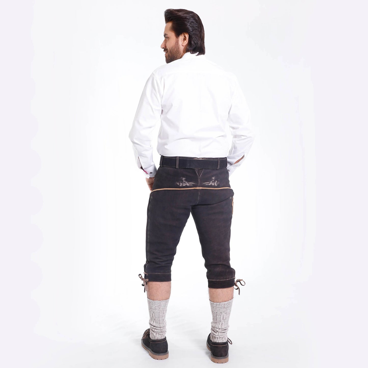 Dark brown lederhosen with embroidered back, belt buckle, and lace-tie knee cuffs.