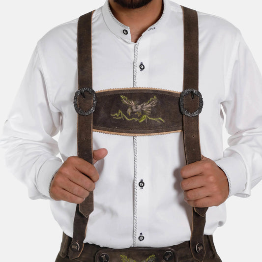 Brown leather suspenders worn with white shirt, decorative center panel and metal clasps