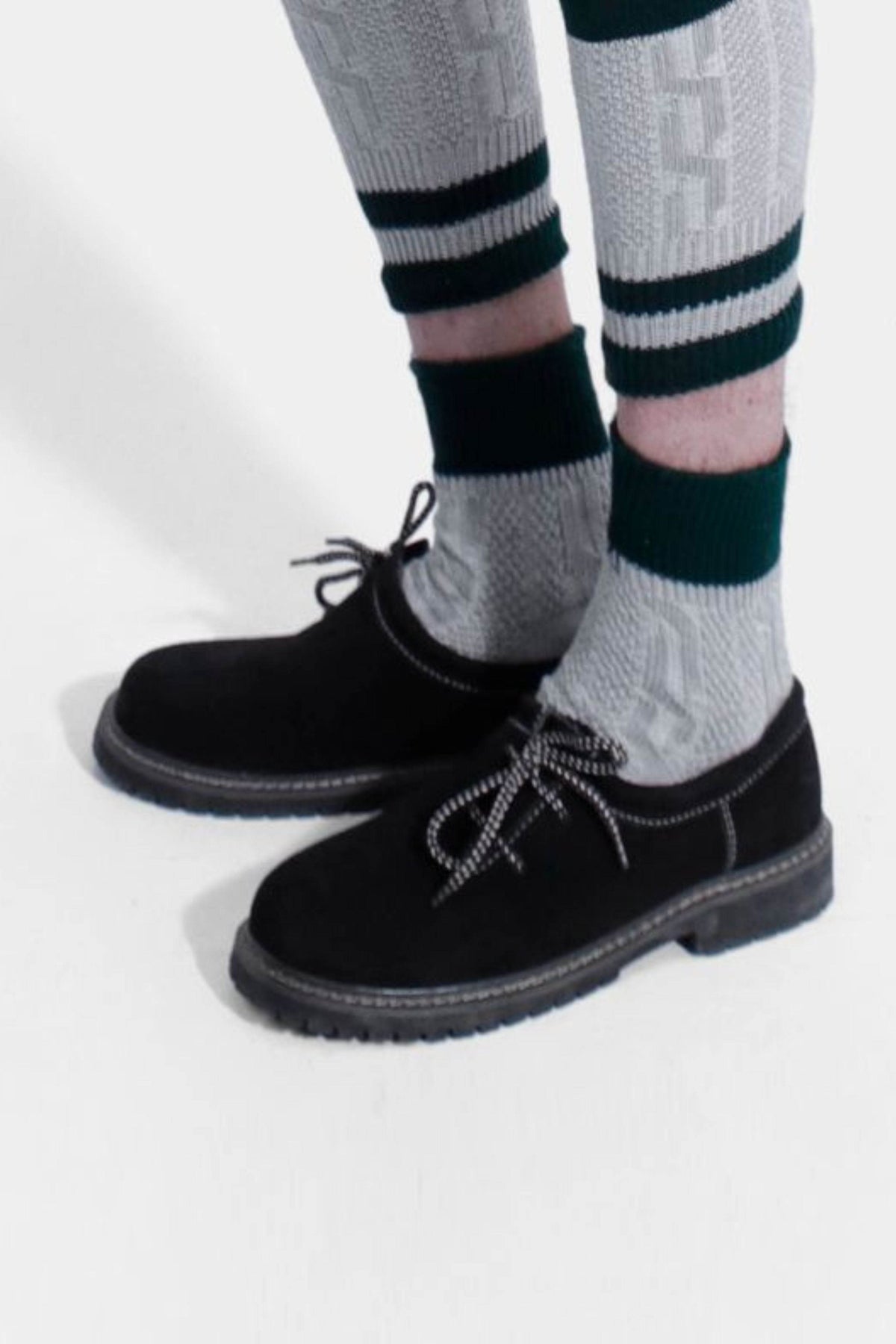Men's dark suede-style lace-up shoes with bow laces and white edge stitching