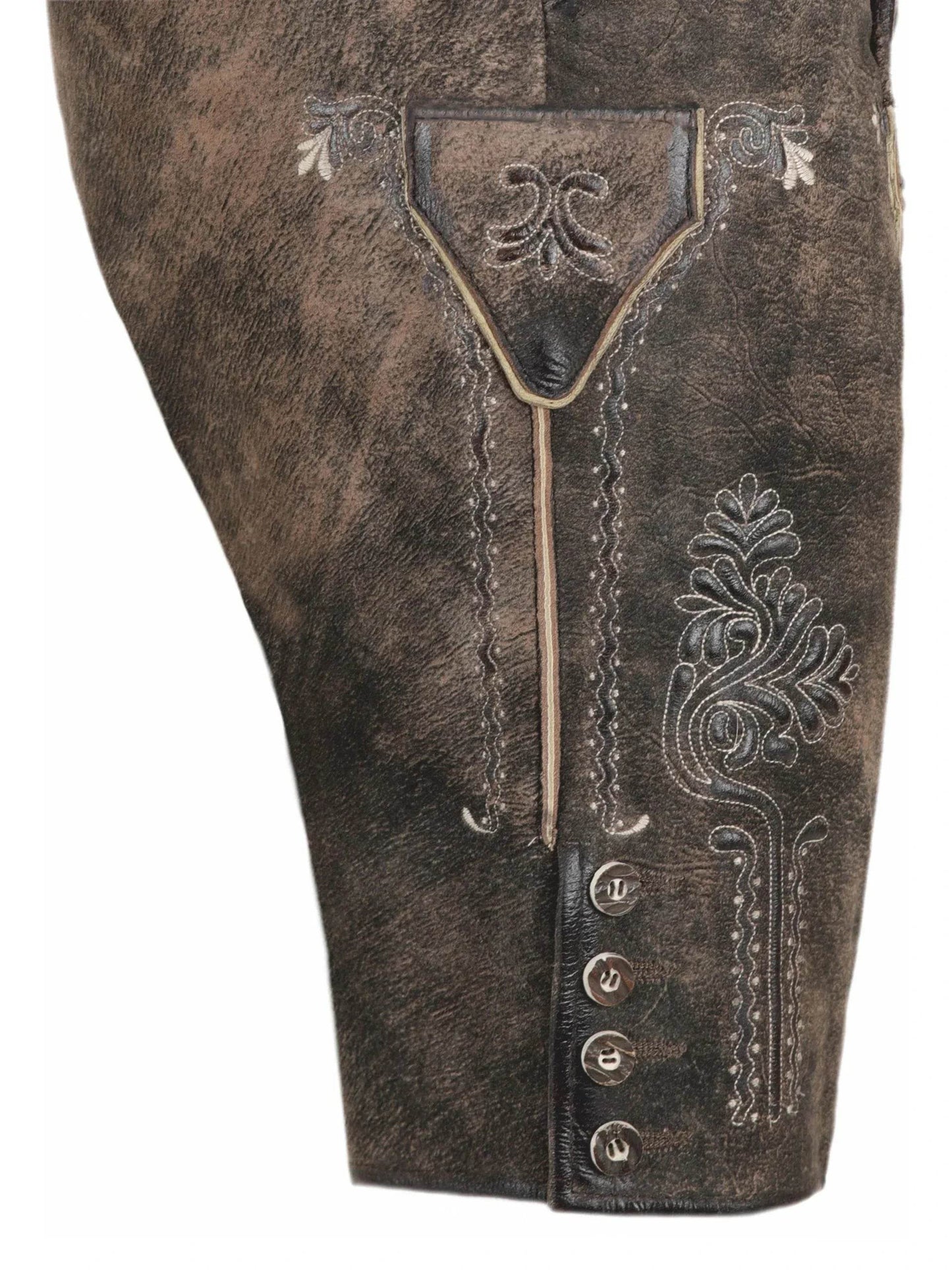 Dark brown lederhosen close-up with embroidered pocket panel and decorative metal buttons