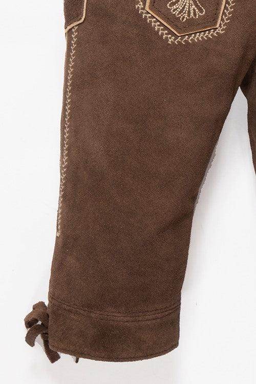 Dark brown lederhosen-style pants with embroidered accents and knotted hem ties