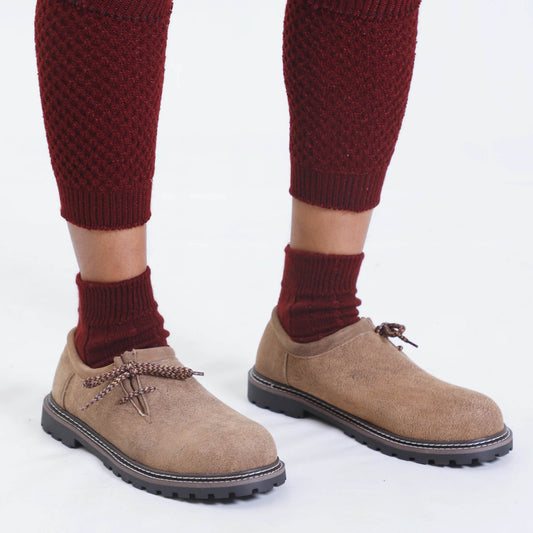 Men's suede lace-up shoes with dark sole and braided bow laces, with red socks
