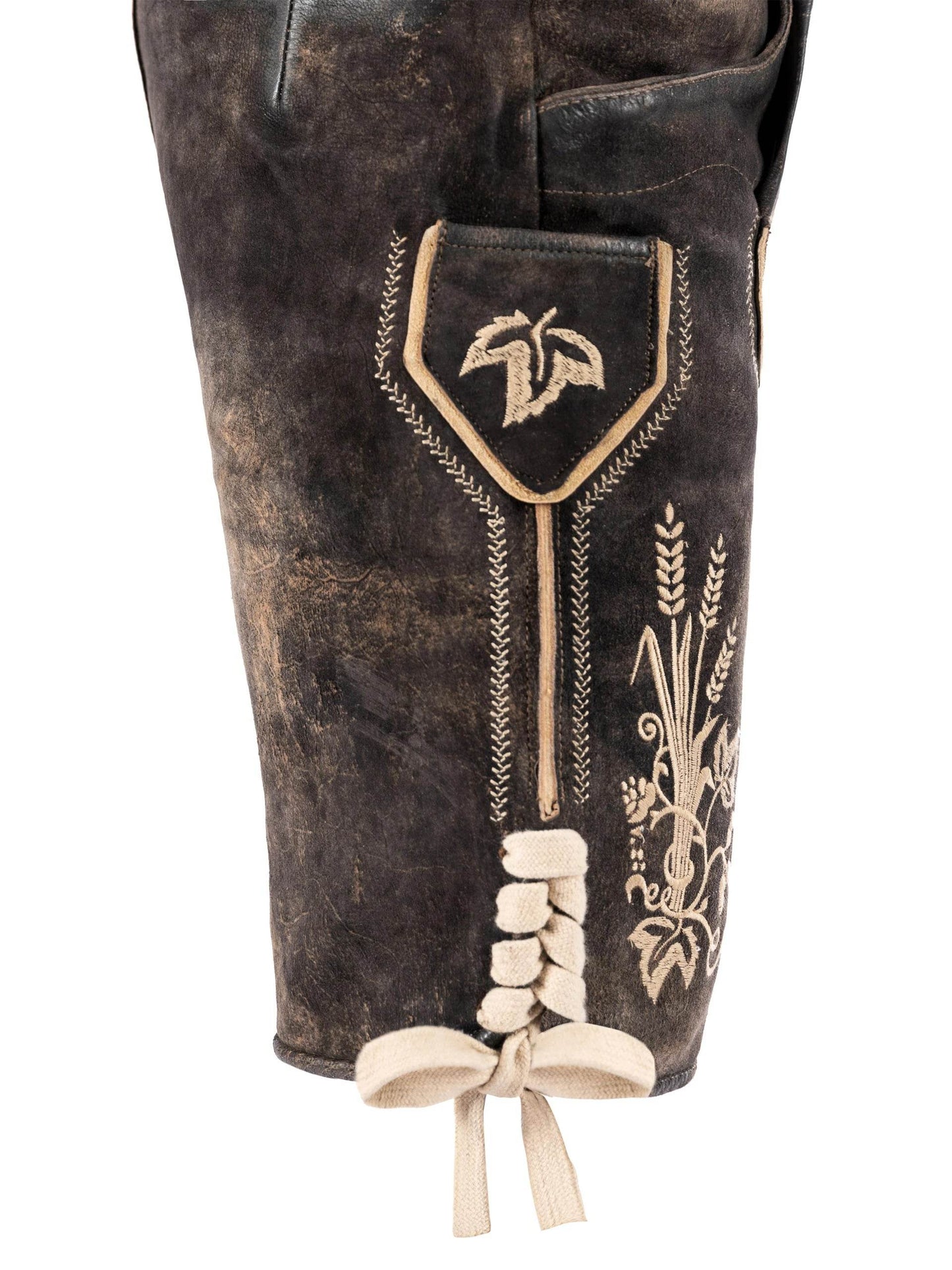 Brown leather lederhosen leg with embroidered crest, wheat motifs, and tie drawstring