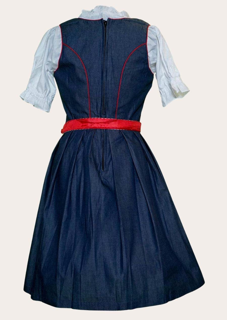Back view of blue dirndl dress with red waist band and puff-sleeve white blouse
