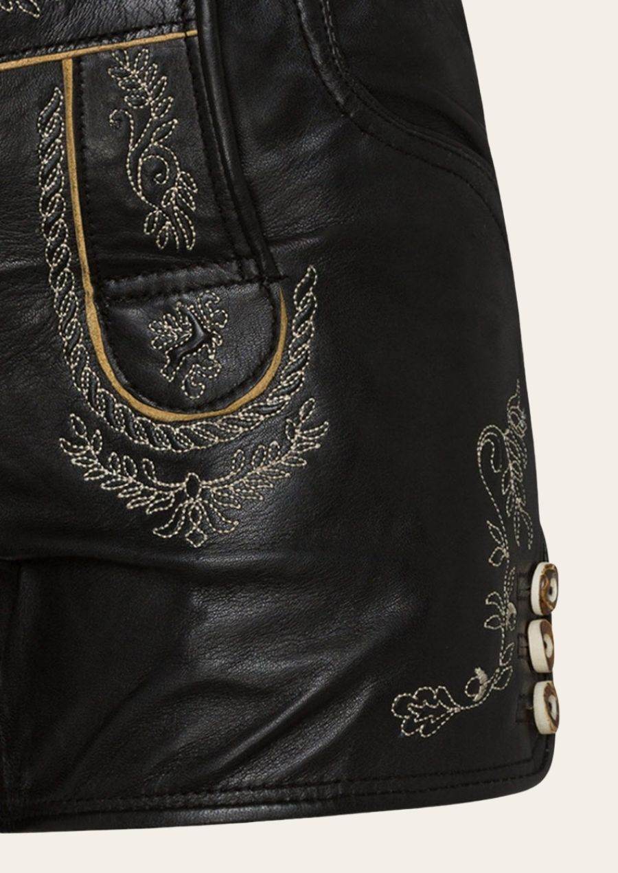 Women’s black leather lederhosen shorts with gold embroidered pocket trim and button