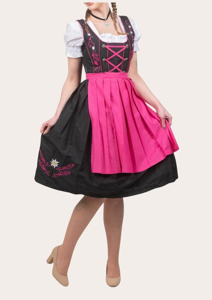 Women’s festive dirndl dress with white puff sleeves, black bodice and magenta full skirt