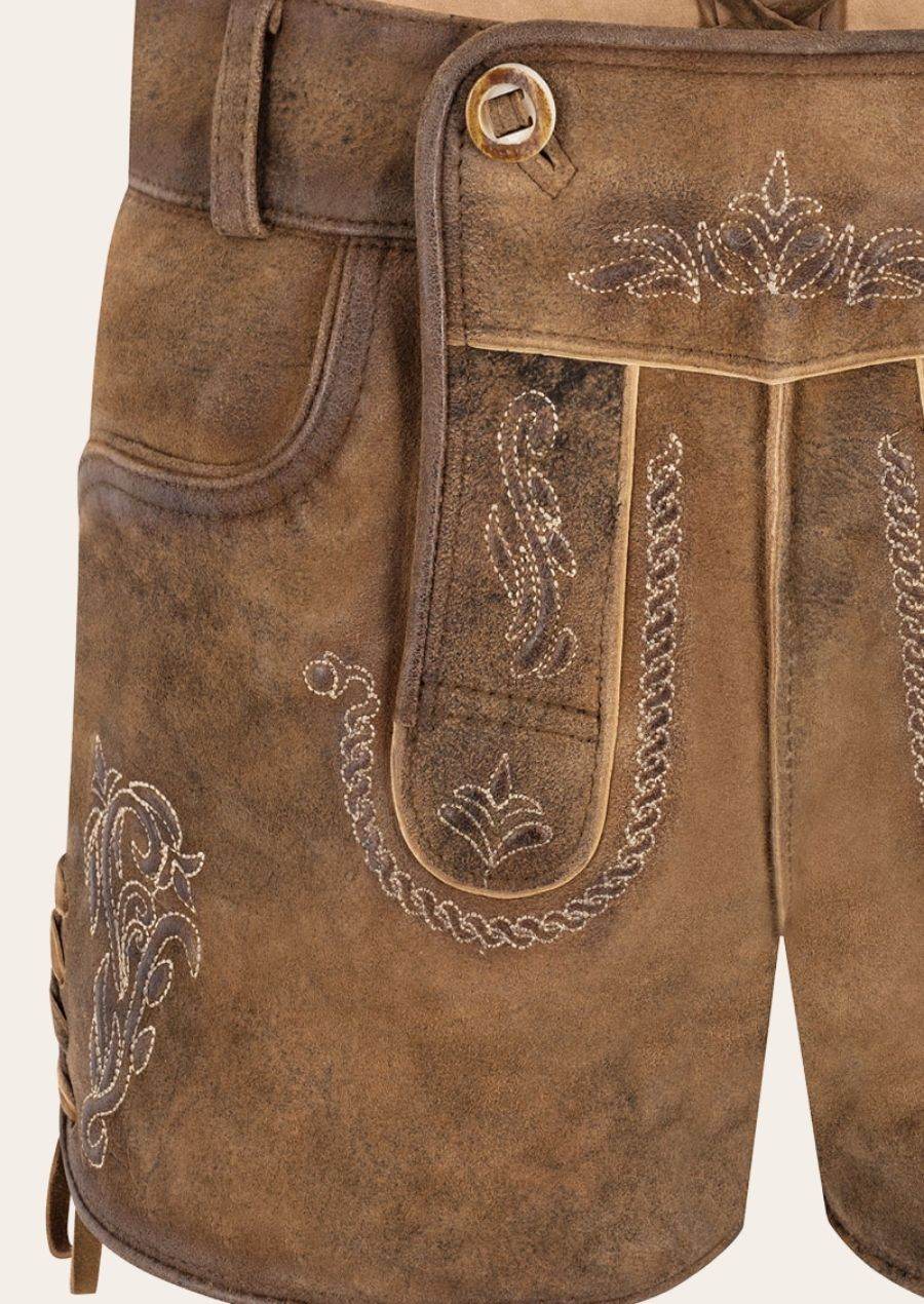 Women's brown leather lederhosen close-up with deer and floral embroidery front
