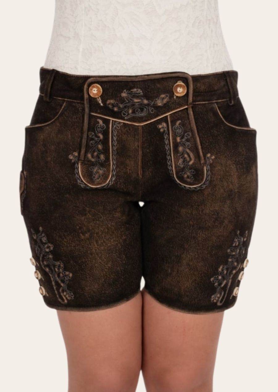 Women's dark brown leather shorts with ornate suspenders-style panels and button closure