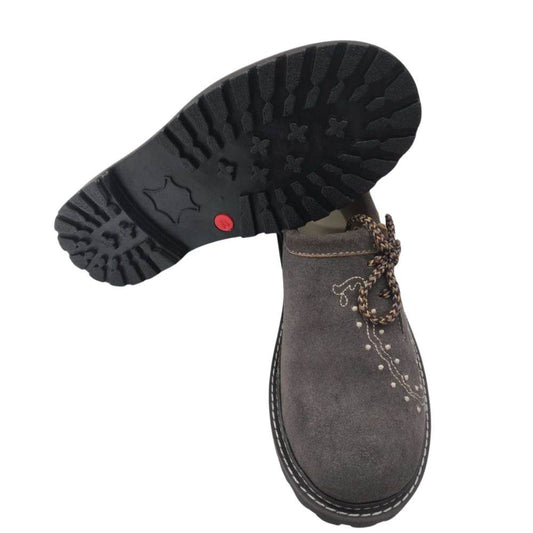 Traditional leather shoes with patterned tread sole, dark upper and braided side laces
