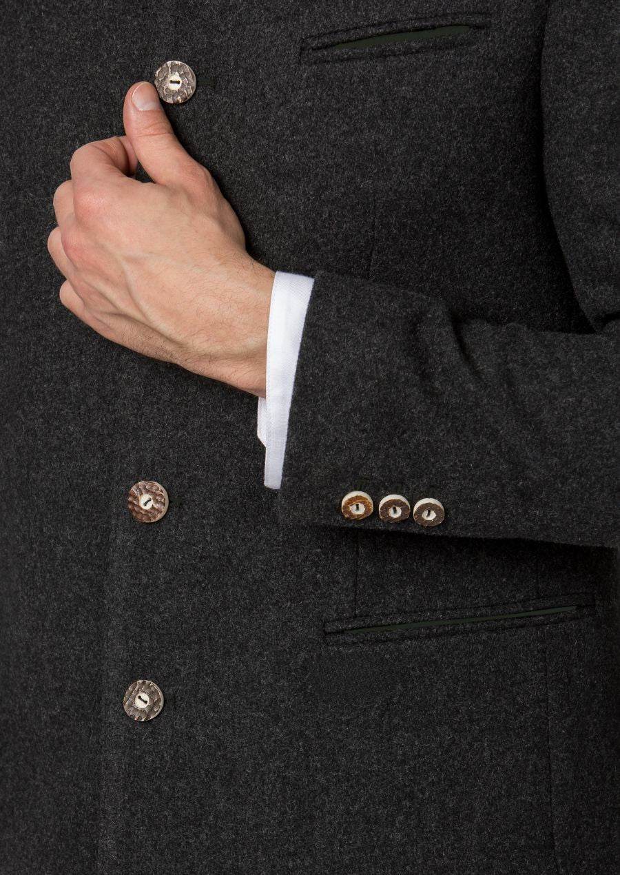 Dark wool jacket cuff close-up with gold-tone buttons