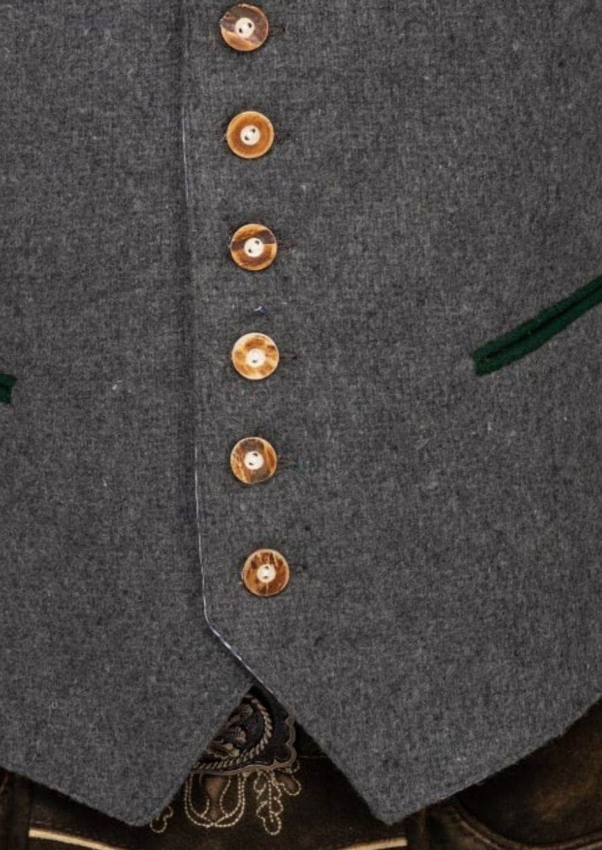 Grey waistcoat front close-up with gold button row and green piping