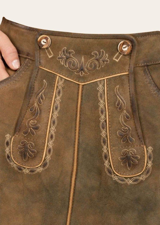 Brown leather skirt front panel with ornate embroidery and decorative metal buttons