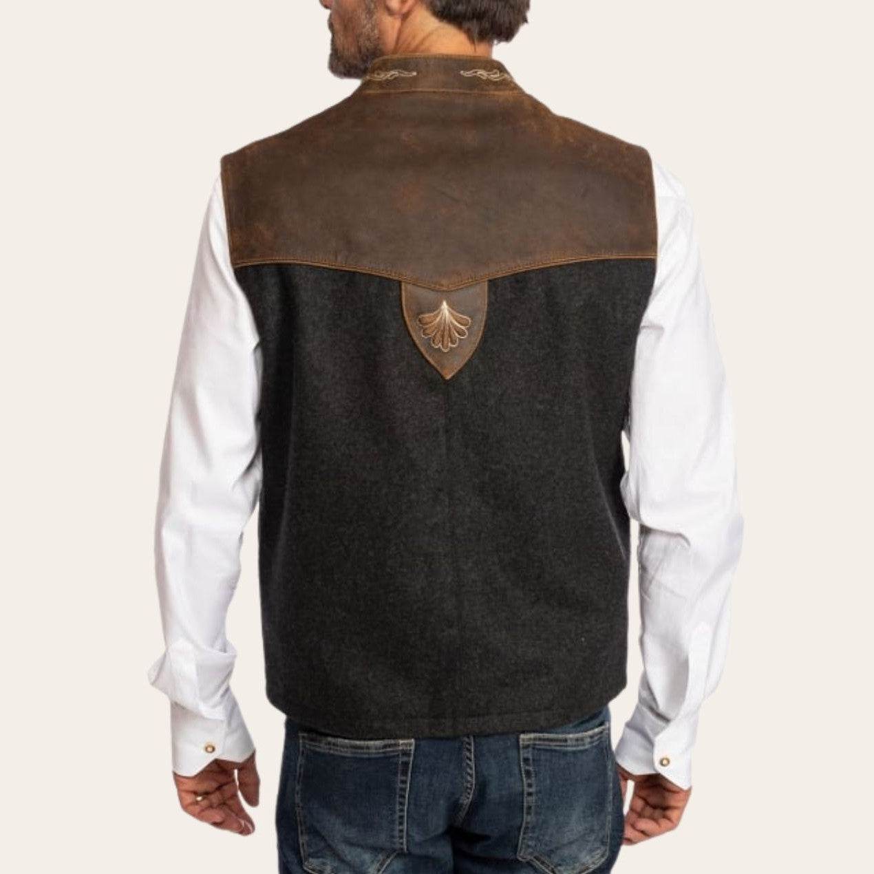 Men's traditional vest back view with brown yoke and central decorative shield emblem