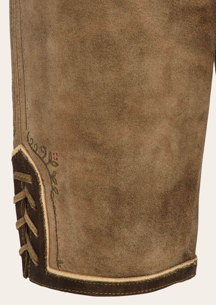 Brown suede knee-length lederhosen hem with braided trim and stitched edge