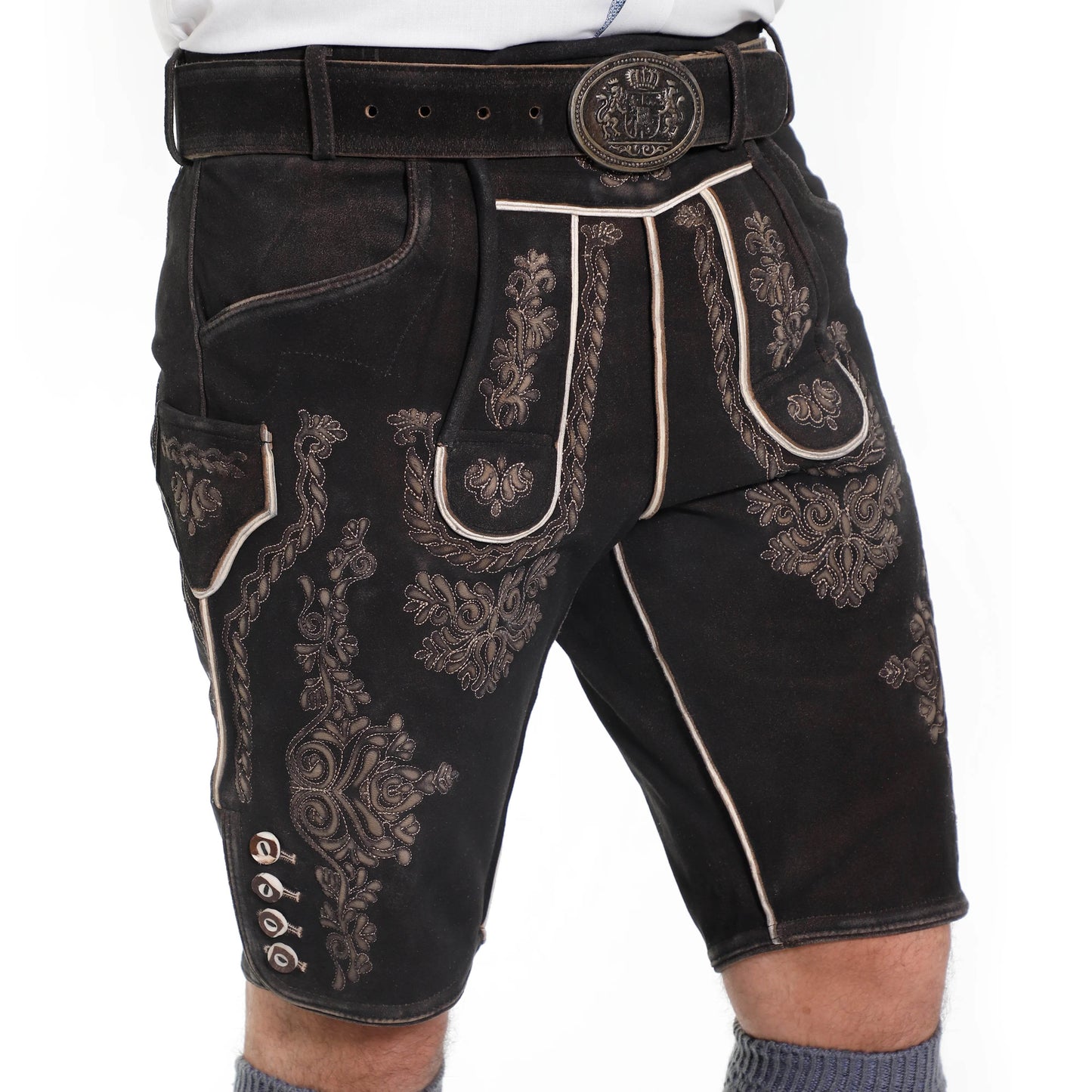 Men's dark suede lederhosen shorts with ornate side embroidery and contrast piping.