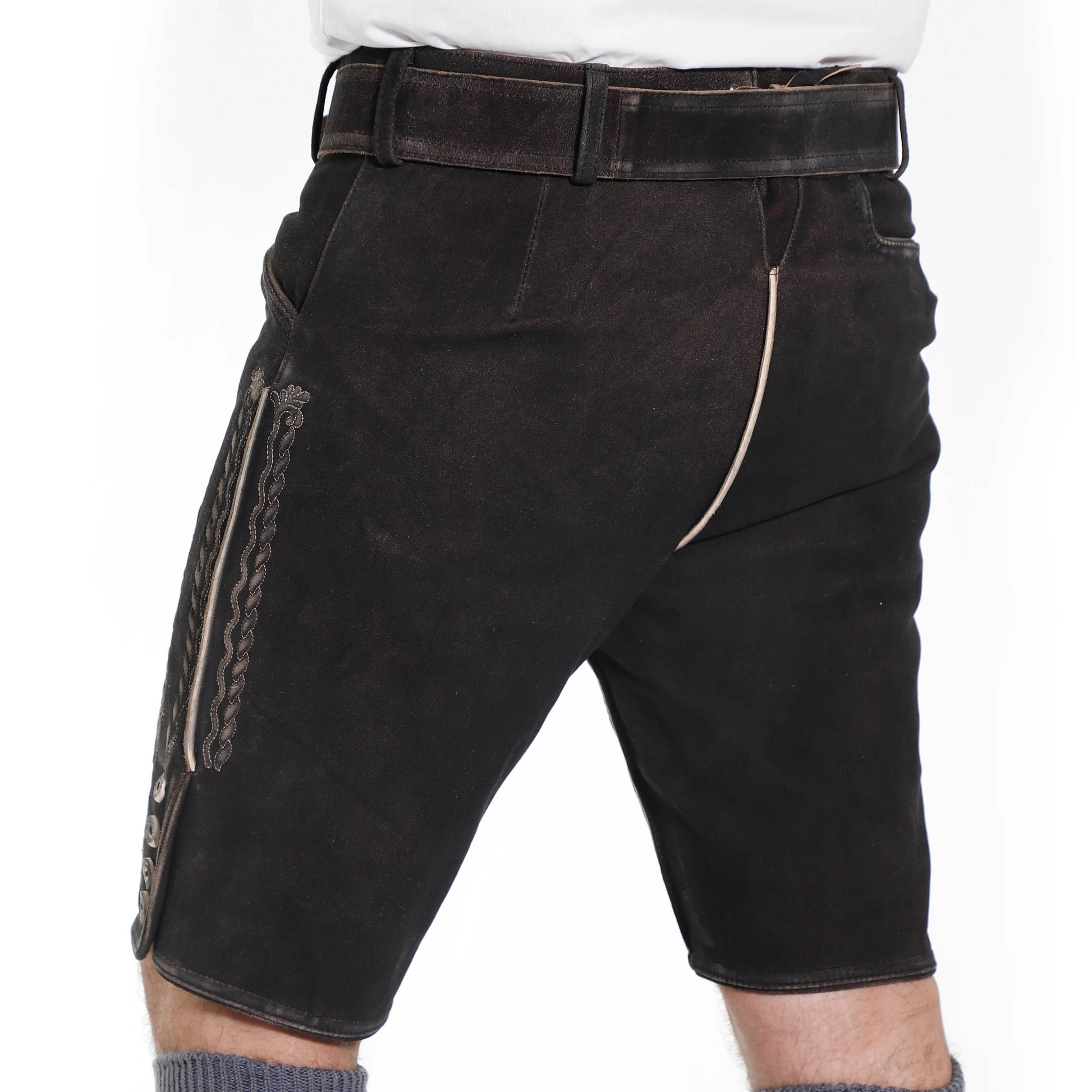 Men's dark suede lederhosen shorts with vertical embroidered motif and stitched seam.