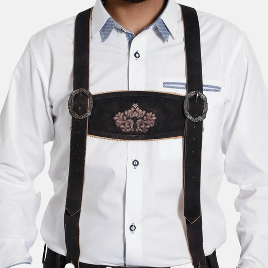 Black leather suspenders with embroidered badge, worn over a white dress shirt