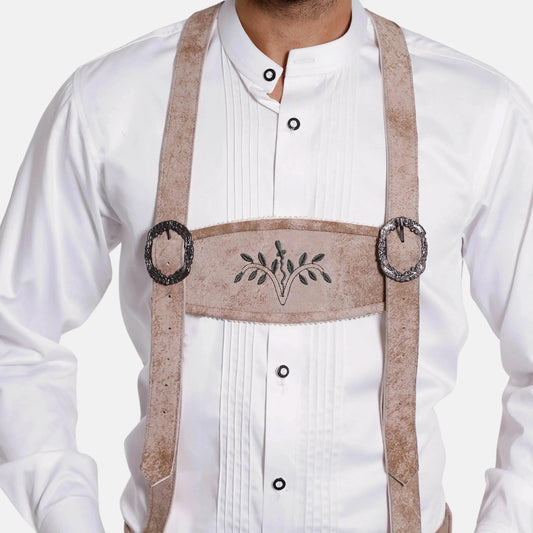 Leather suspenders worn over white shirt, with embroidered centerpiece and metal rings