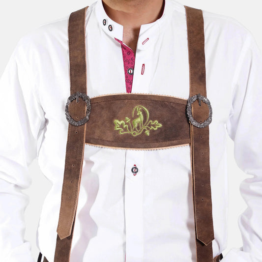 Brown leather braces with green embroidered crest and round metal rings on white shirt