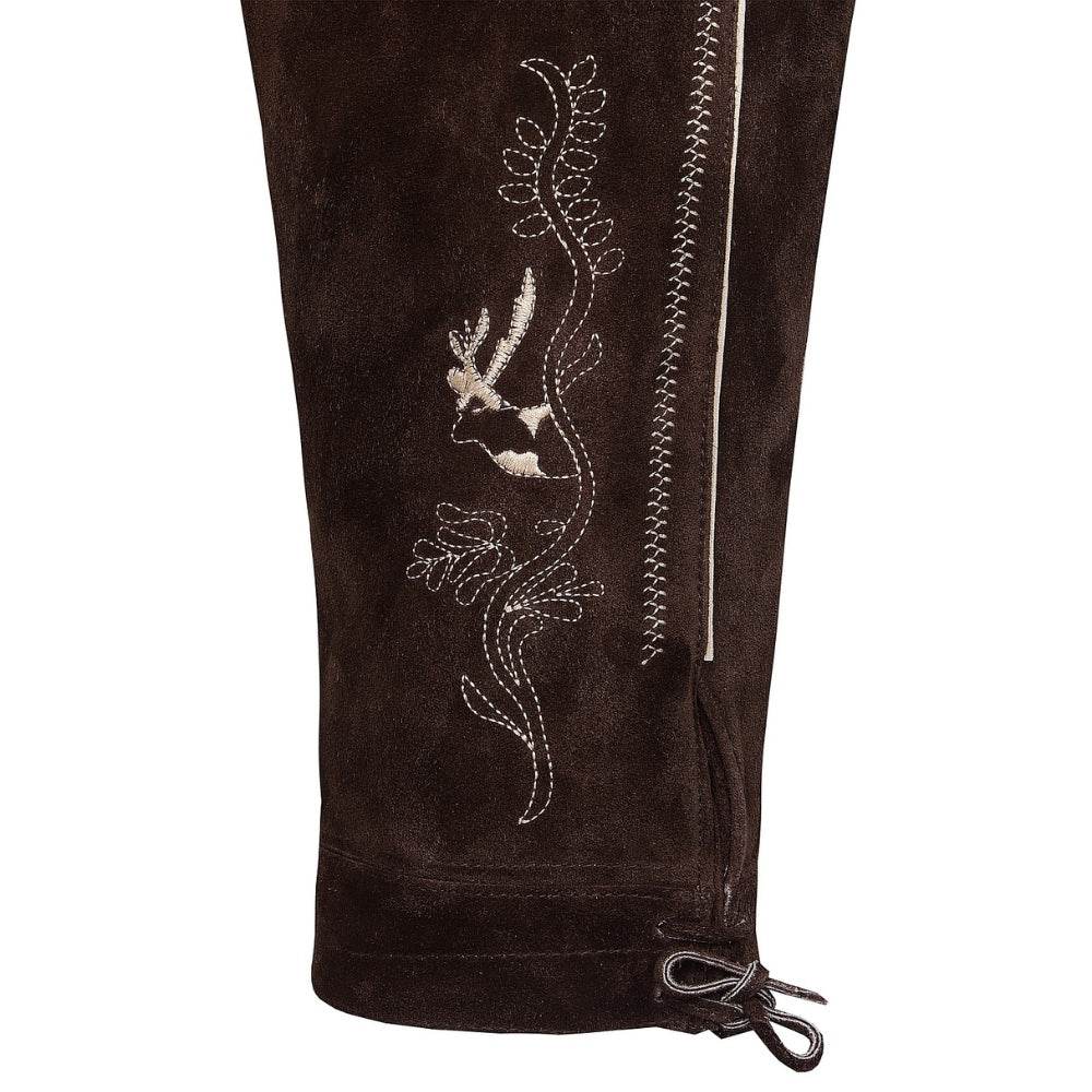 Dark brown lederhosen close-up with floral embroidery, zip seam, and tied hem