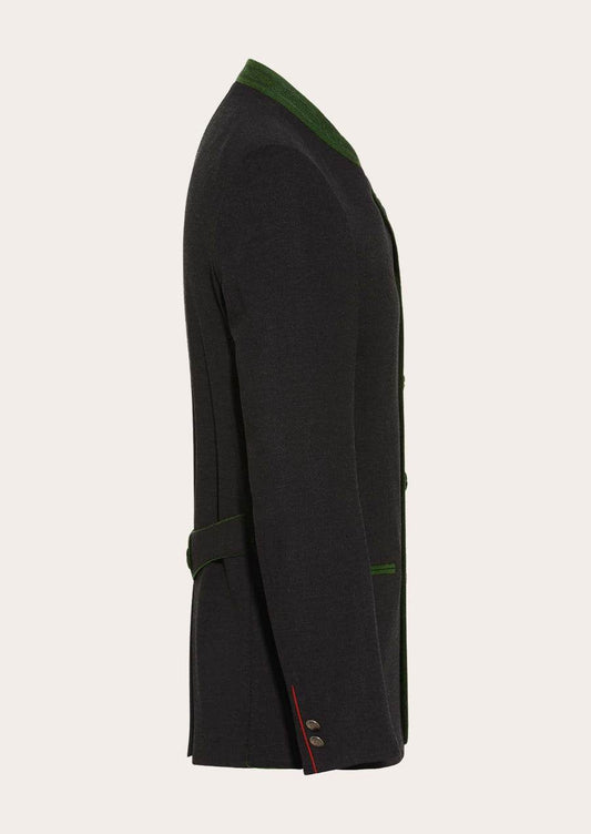 Men's traditional-style jacket side view, black with green trim and cuff strap detail