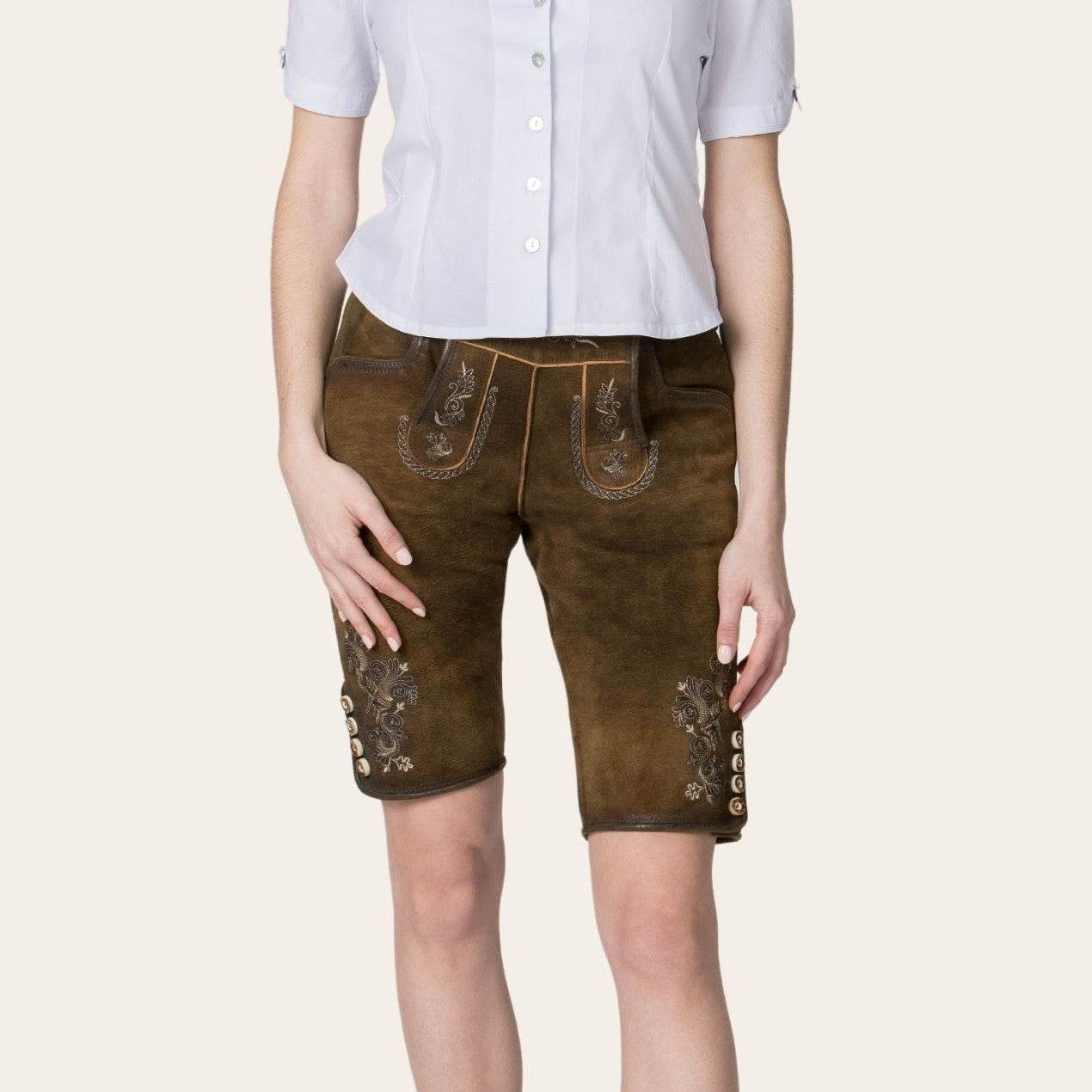Brown lederhosen shorts with suspenders and decorative stitchwork on front and sides